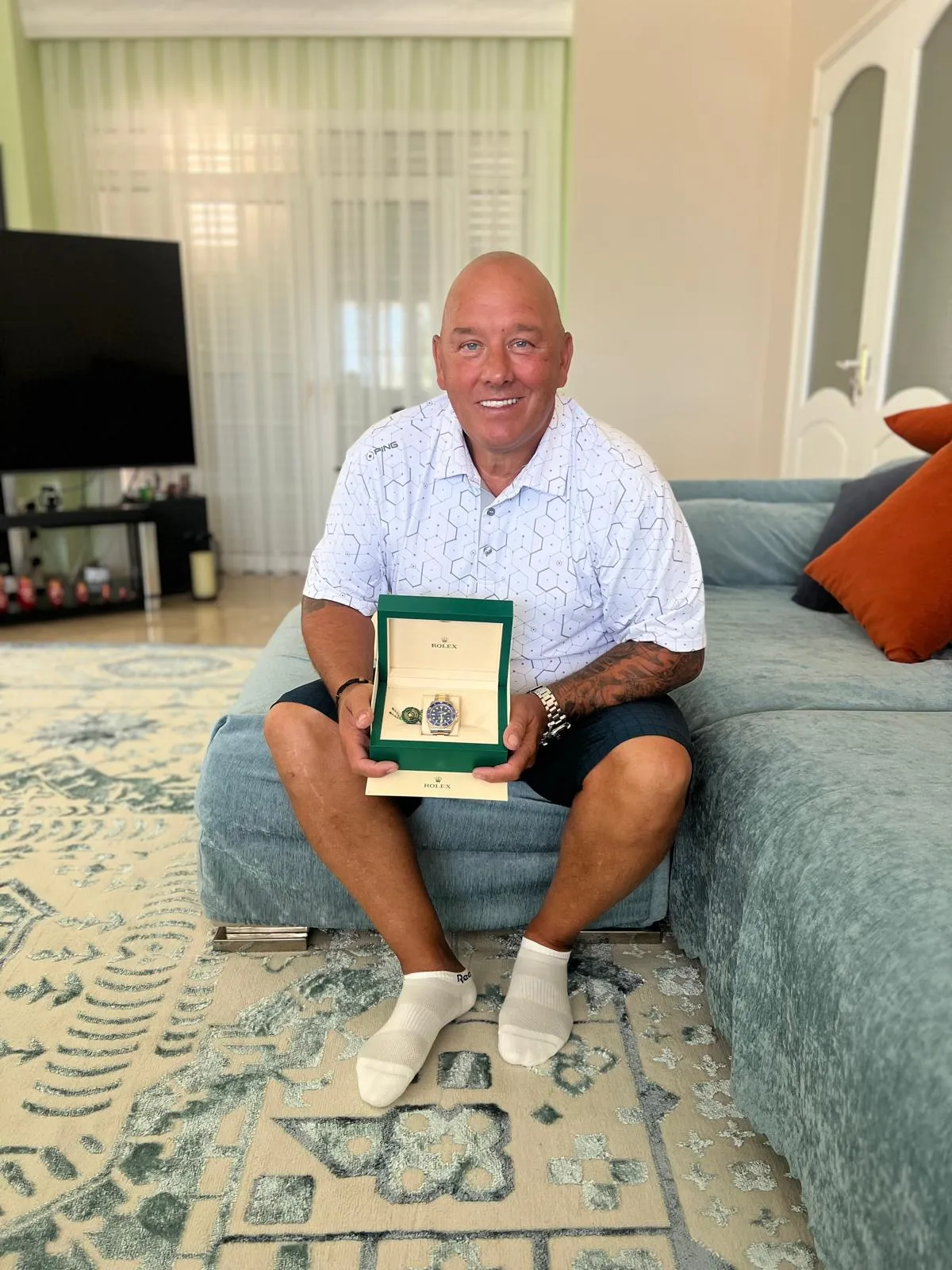 Photo of John Achtenberg with the watch Patek Aquanaut he won